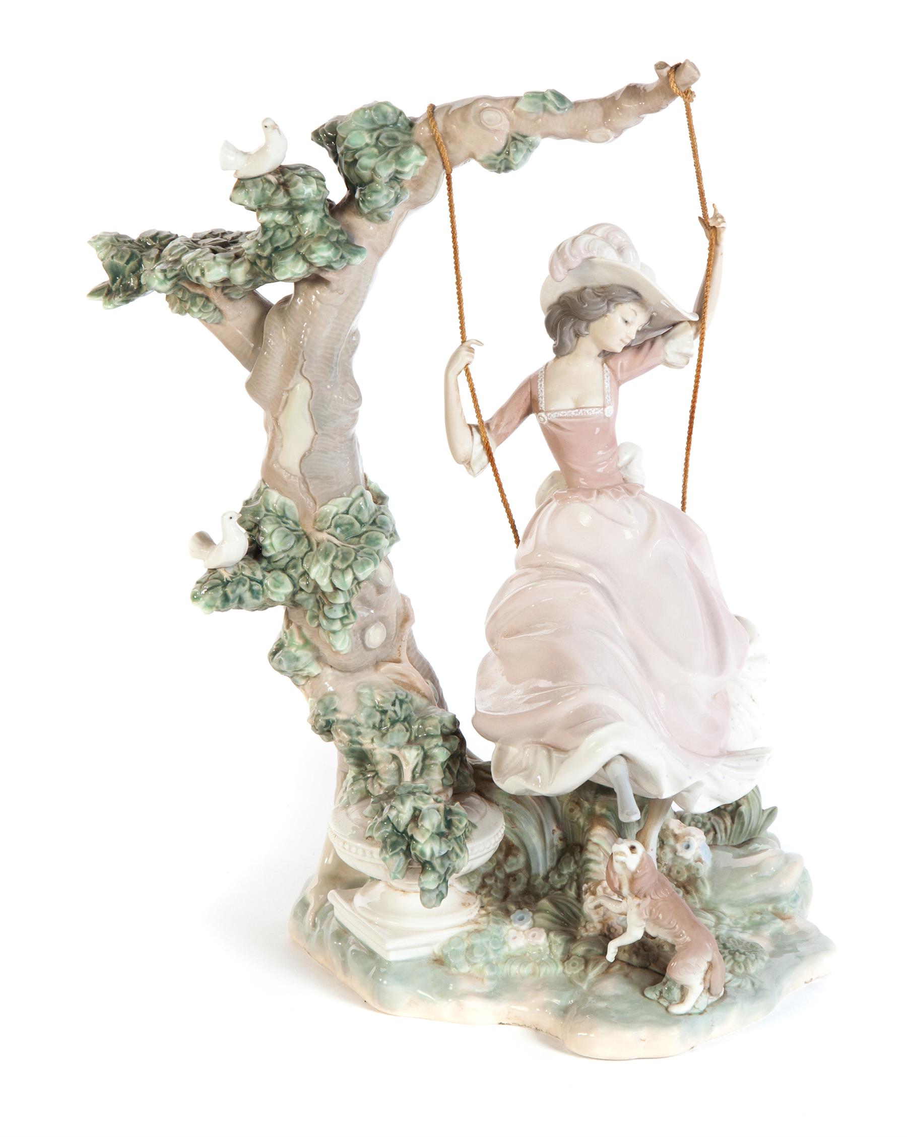 Appraisal: LLADRO FIGURAL GROUP OF YOUNG LADY ON A TREE SWING