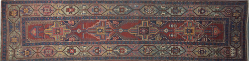 Appraisal: ANTIQUE CAUCASIAN Runner with red blue and yellow geometric pattern