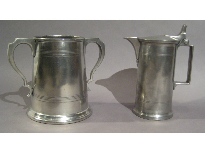 Appraisal: TWO ANTIQUE ENGLISH PEWTER CUPS One lidded with pouring spout