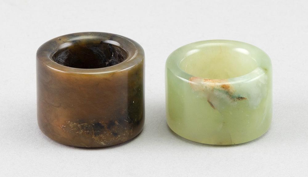 Appraisal: TWO JADE THUMB RINGSTWO JADE THUMB RINGS One light celadon