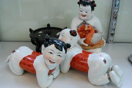 Appraisal: GROUP OF THREE CHINESE PORCELAIN CHILDREN FIGURES STAND