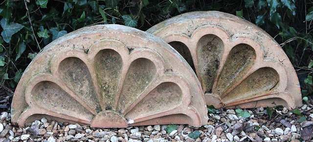 Appraisal: A PAIR OF TH CENTURY STONEWARE SCALLOPED ARCHITECTURAL ELEMENTS cm