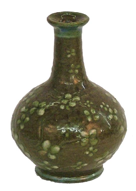 Appraisal: Martin Brothers miniature bottle vase decorated with white highlighted flowerheads