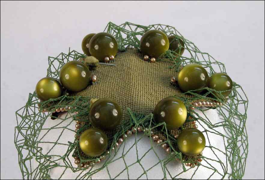 Appraisal: BES-BEN MOONSTONE BALL HAT Olive green fabric star shape with