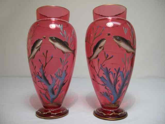 Appraisal: A matched pair of Moser enameled cranberry glass vases with