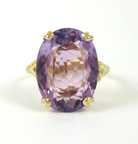 Appraisal: AMETHYST AND EIGHTEEN KARAT GOLD RING set with a single