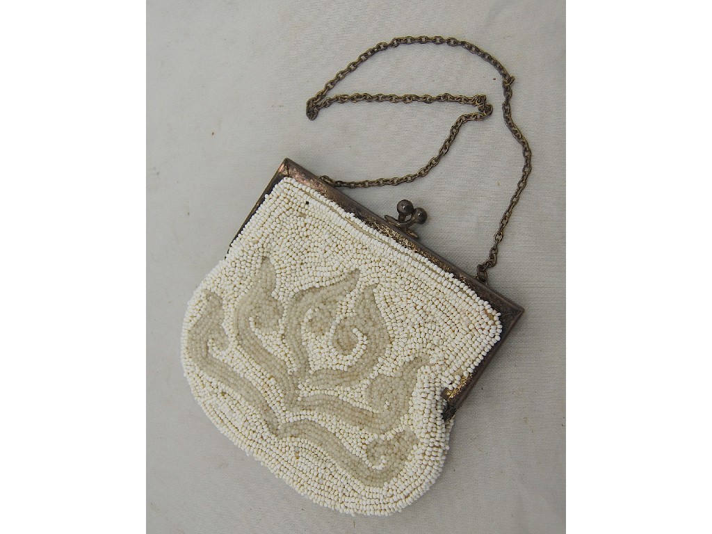 Appraisal: A late Victorian beaded evening purse with white metal clasp