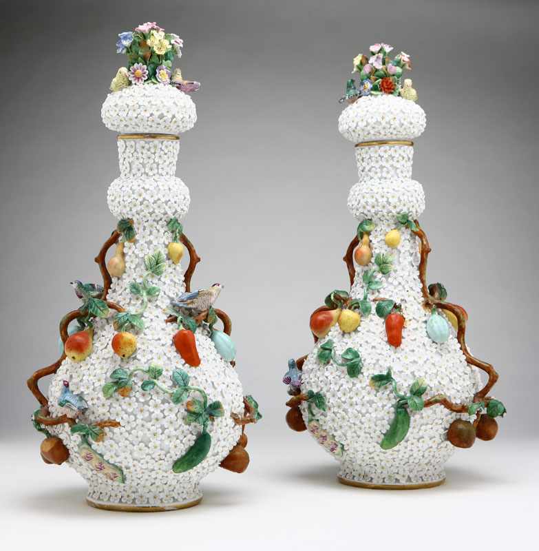 Appraisal: A pair of Meissen style 'Schneeballen' porcelain covered bottle vases