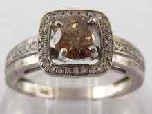 Appraisal: A white metal tests carat gold brown and white diamond