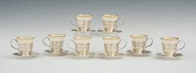 Appraisal: A Set of Eight Sterling Silver and Porcelain Demitasse Cups