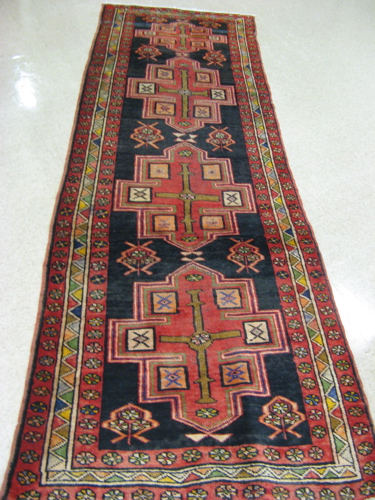 Appraisal: PERSIAN HAMADAN HALL CARPET four geometric medallion design on plain