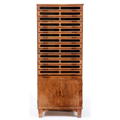 Appraisal: A lightwood and plywood haberdashery cabinet mid th c of