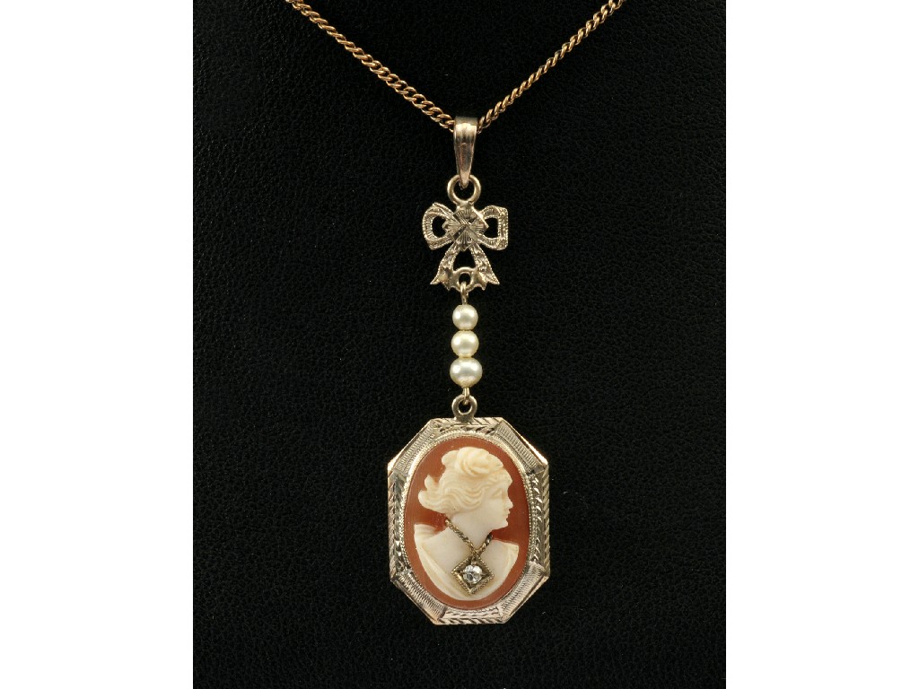 Appraisal: A carved shell Cameo Pendant set circular-cut diamond in white