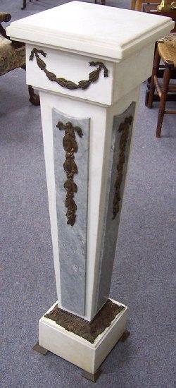 Appraisal: A white marble pedestal of tapering form set ormolu swags