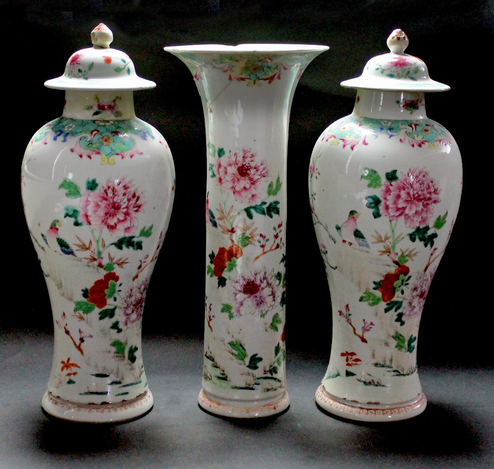 Appraisal: A pair of Chinese famille rose baluster vases and covers