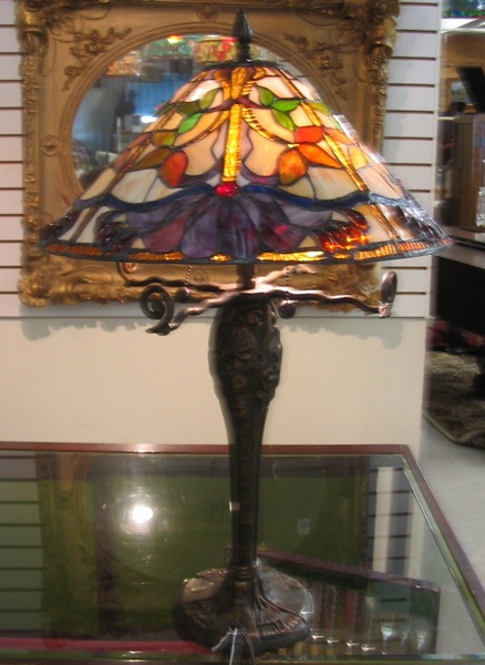 Appraisal: A TIFFANY STYLE TABLE LAMP in colorful floral motif The