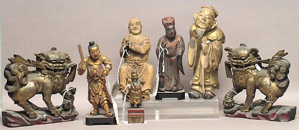 Appraisal: A group of Chinese gilt and painted wood carvings Including