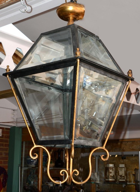 Appraisal: A GILDED BRASS AND WROUGHT IRON HANGING LANTERN of four