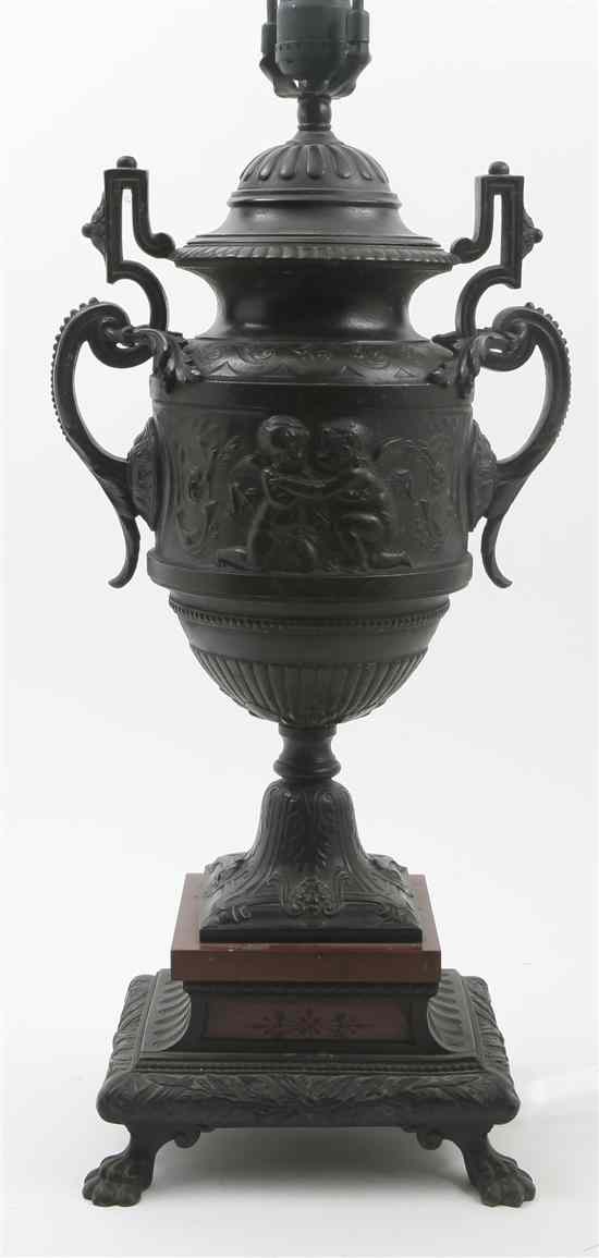 Appraisal: A Continental Bronzed Metal Urn having scrolling handles with acanthus