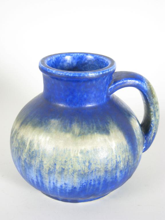 Appraisal: A Ruskin Pottery Jug having loop handle decorated blue and