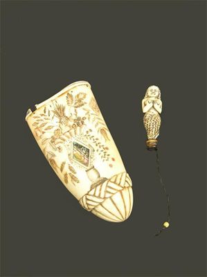 Appraisal: A carved scrimshaw tobacco box engraved a vase of fruit