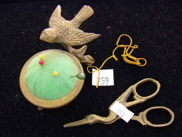 Appraisal: Green pin cushion on bird stand with scissors