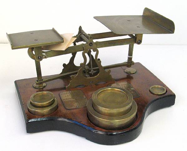 Appraisal: An English brass part ebonized walnut postal scale with five