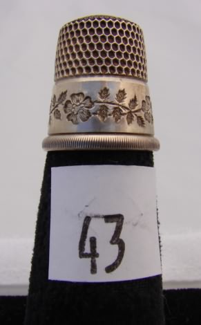 Appraisal: Sterling thimble with floral band