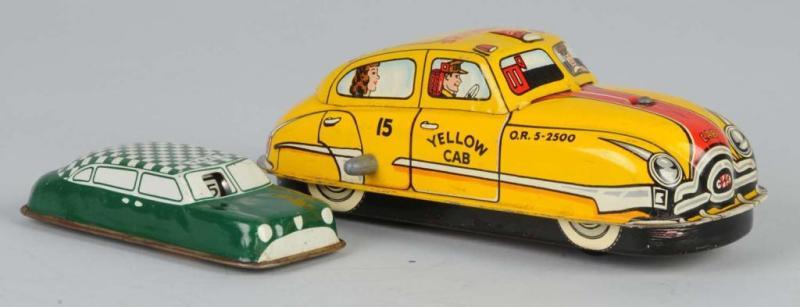 Appraisal: Lot of Tin Wind-Up Friction Taxi Toys Description American Working