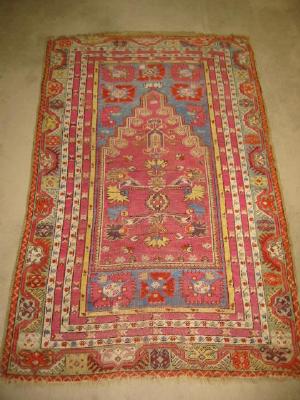 Appraisal: AN ANTIQUE TURKISH PRAYER RUG the navy blue field with