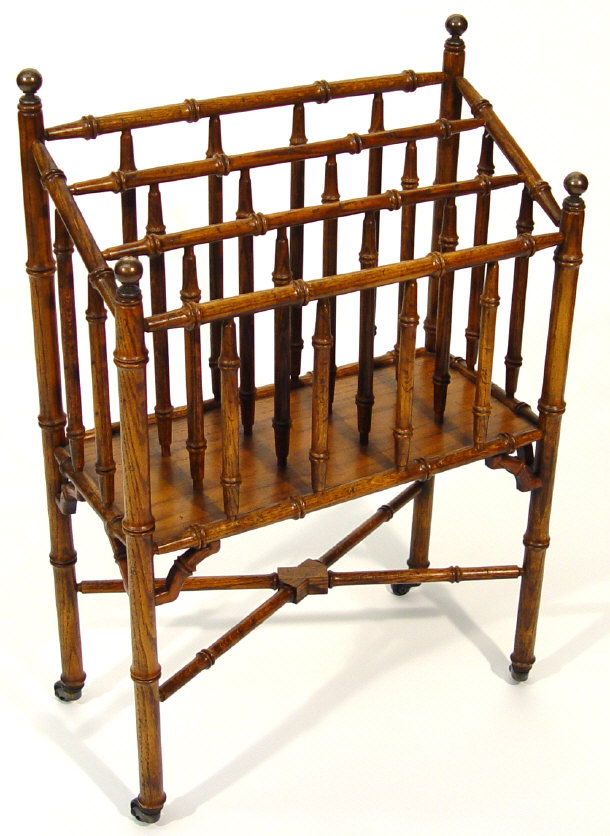 Appraisal: Oak simulated bamboo three-divisional magazine rack with X-shaped stretcher and