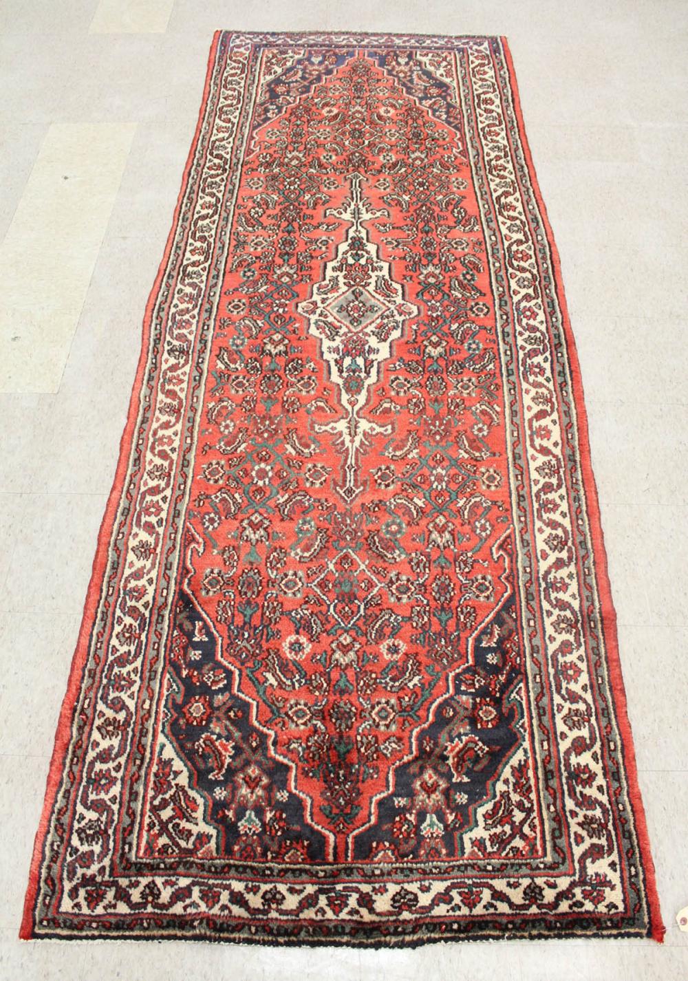 Appraisal: HAND KNOTTED PERSIAN AREA RUG central medallion and Herati floral