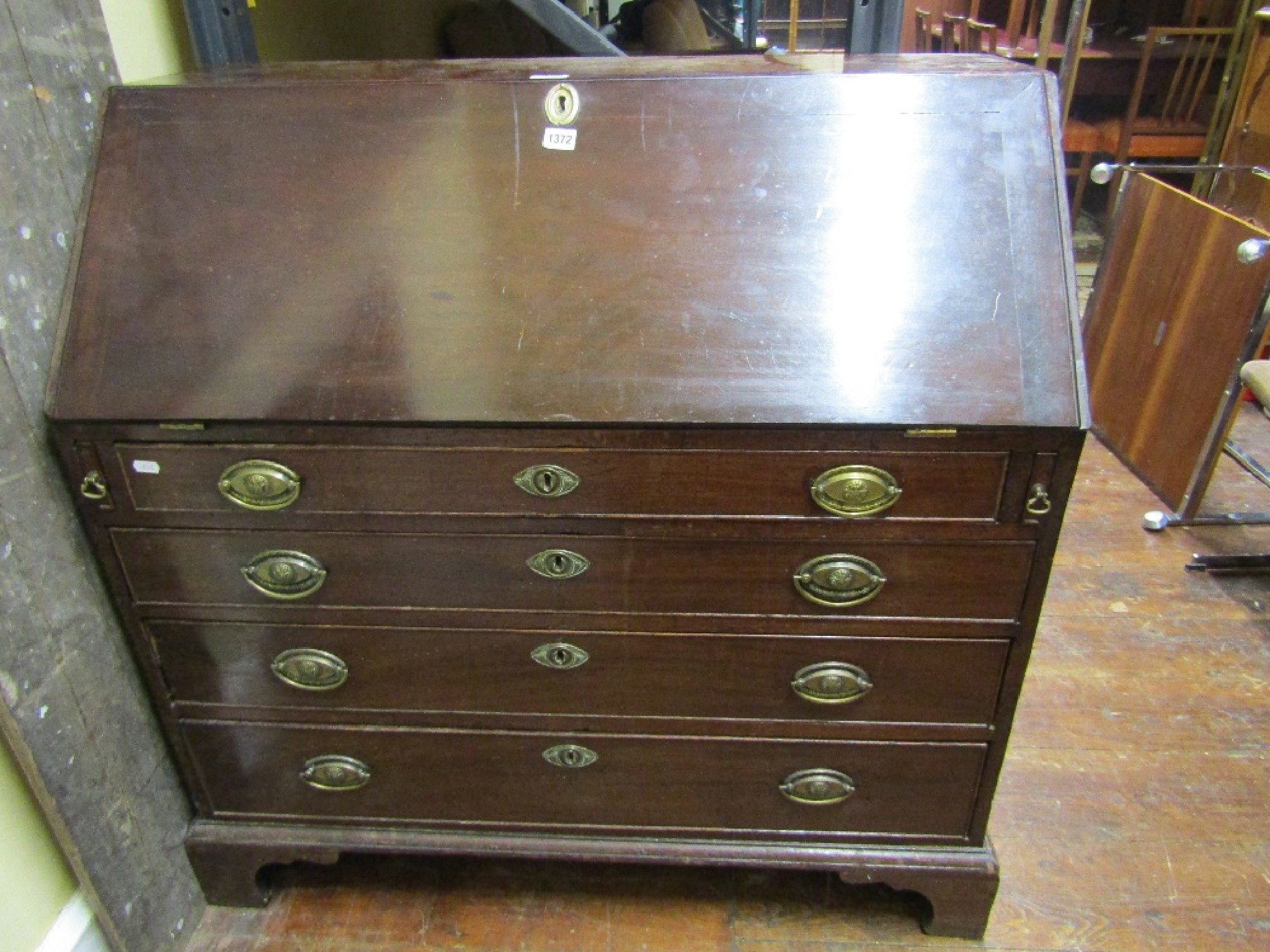 Appraisal: A Georgian mahogany bureau of four long drawers the fall