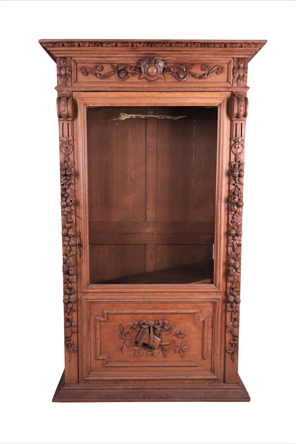 Appraisal: CARVED WALNUT GLASS FRONT BOOKCASEwith interior shelves inches wide inches