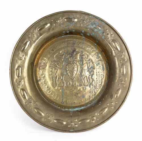 Appraisal: Nuremberg brass alms dish dated with embossed scene of the