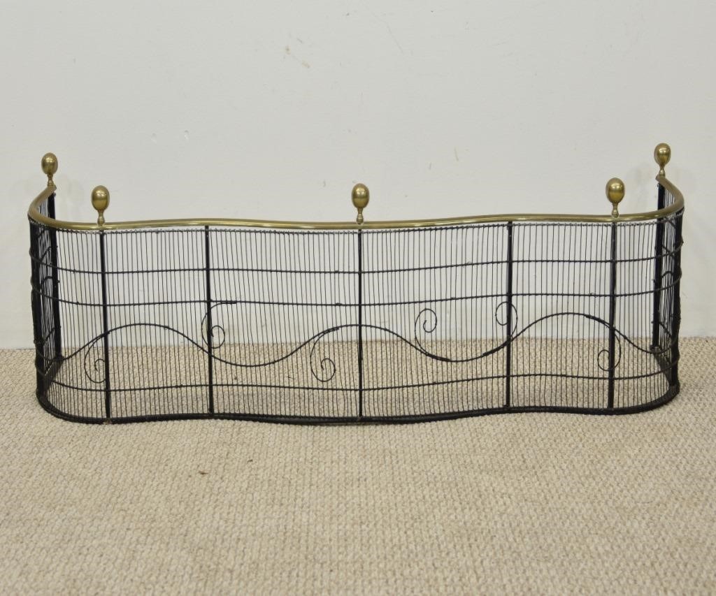 Appraisal: Brass and wire serpentine front fire fender th c with