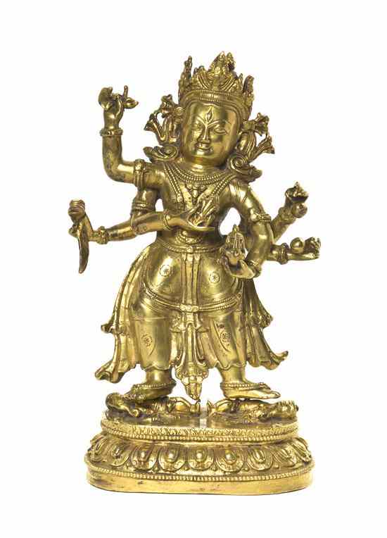 Appraisal: A Gilt Bronze Model of a Standing Deity depicted with