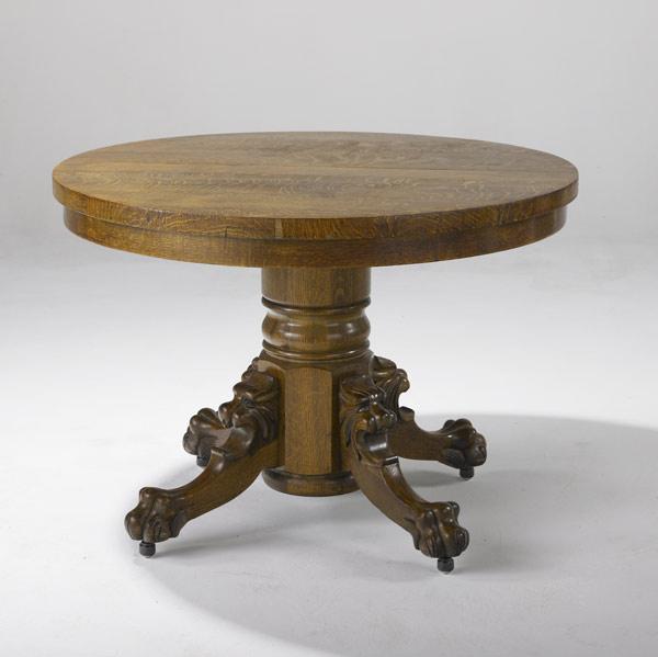 Appraisal: NATIONAL FURNITURE CO Oak pedestal table with elaborately carved paw