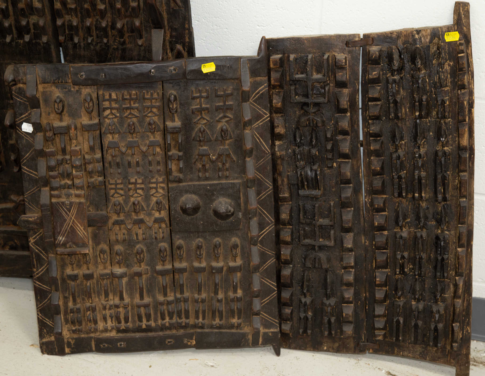 Appraisal: TWO AFRICAN DOGON STYLE CARVED WOOD GRANARY DOORS Mali th