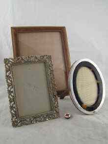 Appraisal: A mixed lot An oval silver faced photo frame with