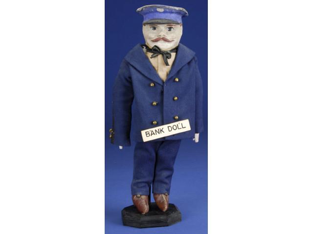 Appraisal: Alms Soldier Bank Doll Ca molded and painted composition head