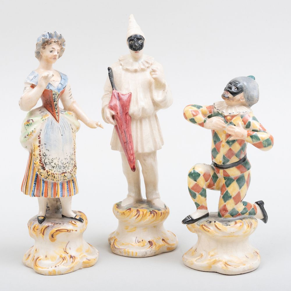 Appraisal: Two Continental Pottery Figures of Harlequins and a Figure of