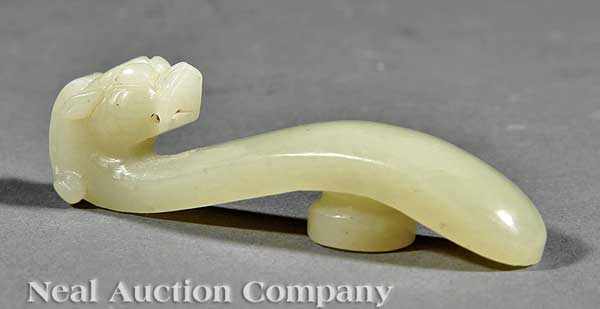 Appraisal: A Chinese Creamy White Jade Belt Hook Qing Dynasty -