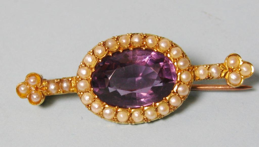 Appraisal: A Bar Brooch set large oval amethyst surrounded by seed