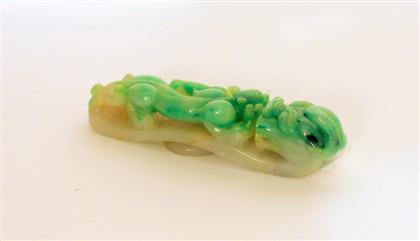 Appraisal: Chinese jadeite belt-hook Of typical long oval form qilong and