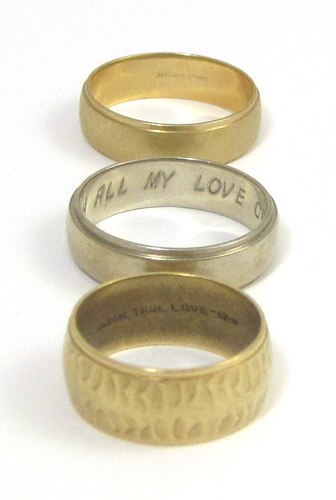 Appraisal: THREE FOURTEEN KARAT GOLD BANDS including a yellow gold band