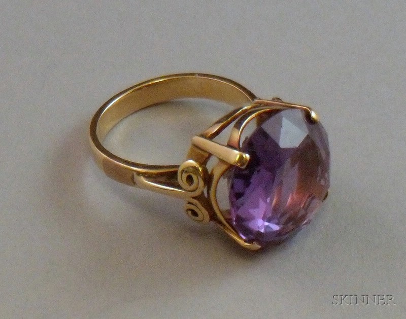 Appraisal: Gold and Gemstone Ring the large circular-cut gemstone set in