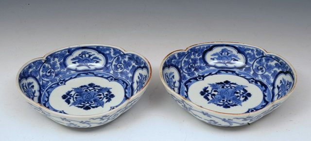 Appraisal: A PAIR OF JAPANESE BLUE AND WHITE QUATREFOIL DISHES with