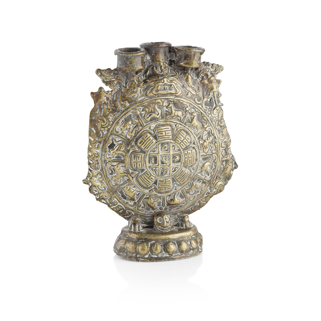 Appraisal: BRONZE 'EIGHT TRIGRAMS' CANDELABRA decorated in mid-relief with two concentric