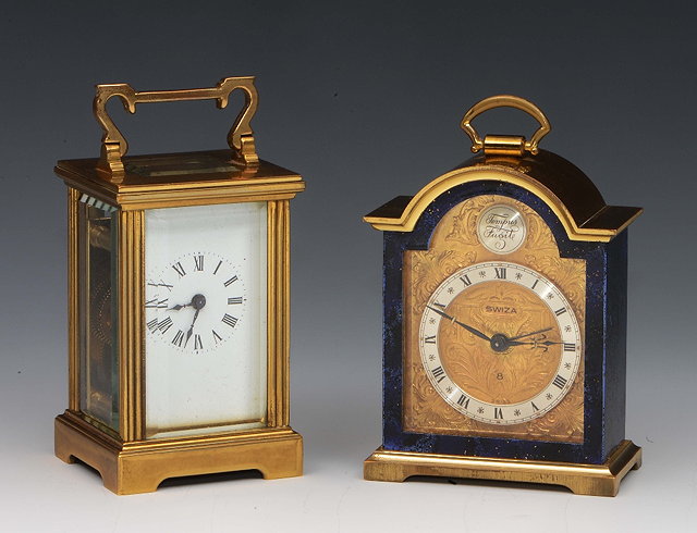 Appraisal: A miniature brass carriage timepieceand a miniature Swiza mantel clock